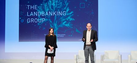 Two speakers on stage giving presentation