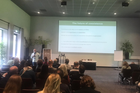 John Linnell speaking at the Wolves Across Borders Conference 2025. 